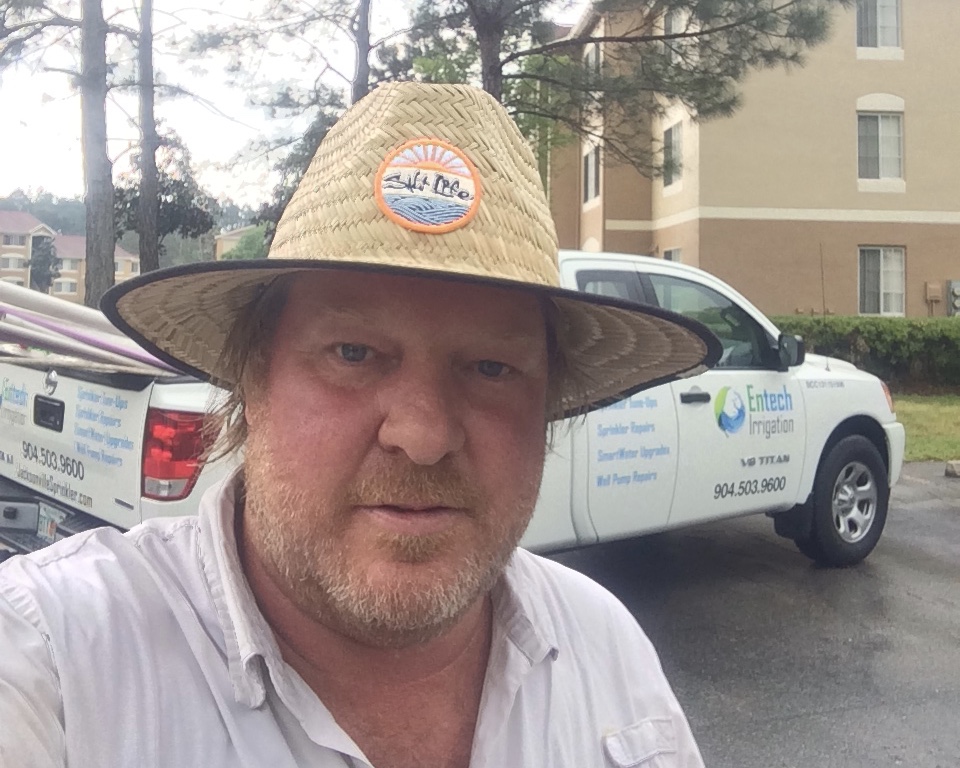 Andrew Brockman on the job in front of an Entech Irrigation truck